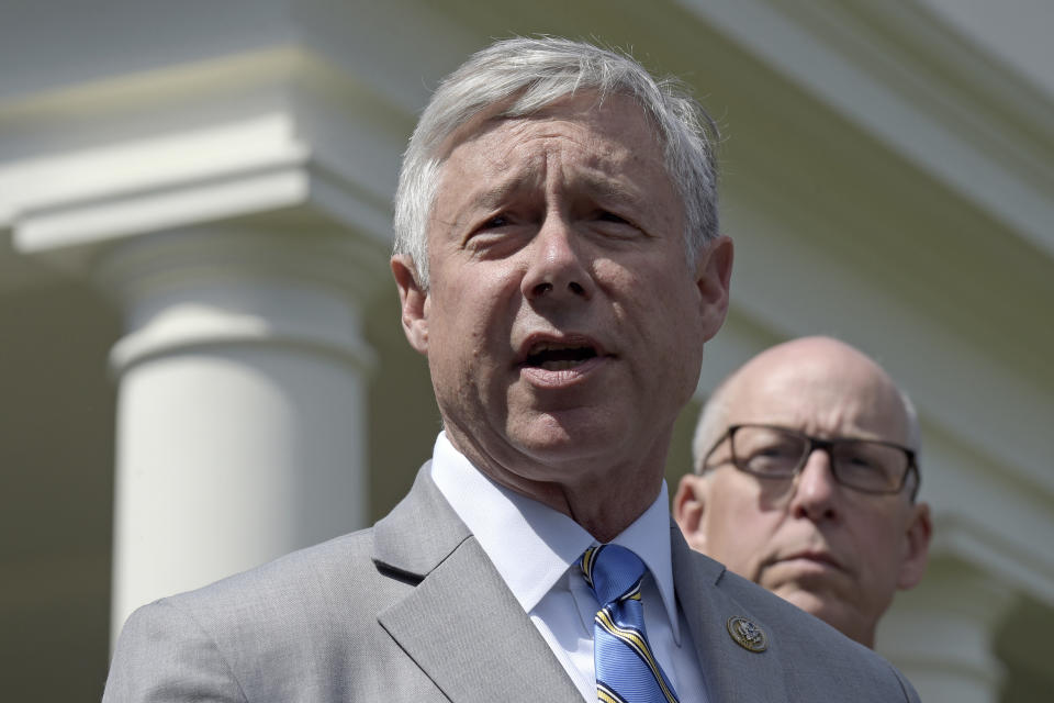 FILE - In this May 3, 2017, file photo, Rep. Fred Upton, R-Mich., left, speaks to reporters outside the White House in Washington. Upton, said he doesn't support a formal impeachment inquiry against President Donald Trump. But he has no problem with Democratic-led committees digging for more information. Upton told the Detroit Economic Club that "we need to know what the answers are." He shared the stage Wednesday, Oct. 2, 2019 with Democratic Rep. Debbie Dingell. (AP Photo/Susan Walsh, File)