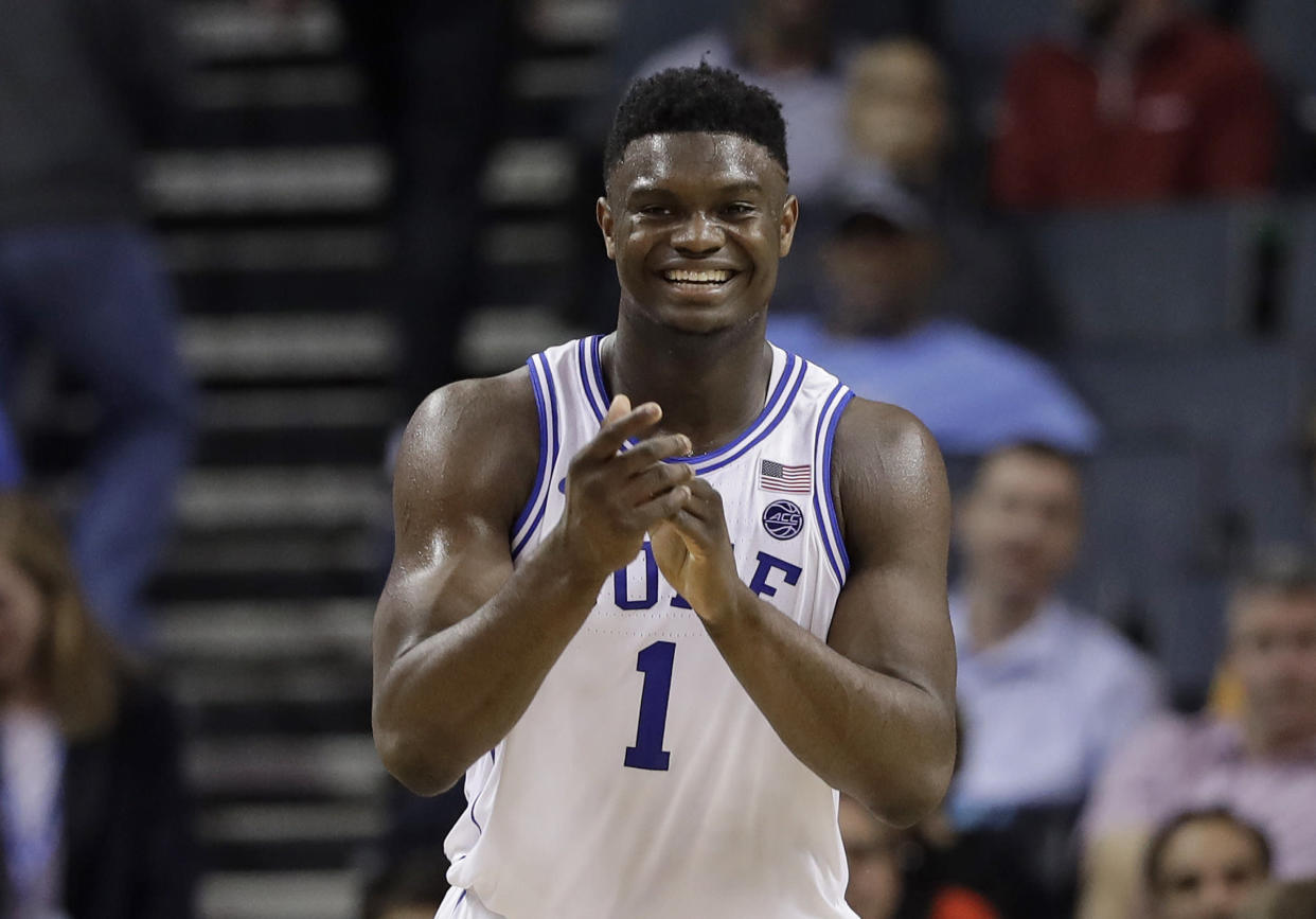 Duke's Zion Williamson (1) smiles after a play against Syracuse during the second half of an NCAA college basketball game in the Atlantic Coast Conference tournament in Charlotte, N.C., Thursday, March 14, 2019. (AP Photo/Chuck Burton)