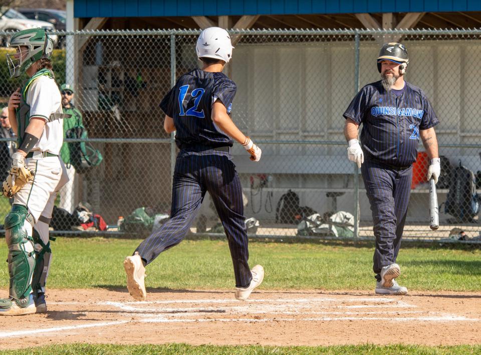 Quinsigamond's Ismael De La Cruz scores from third on an error during Paul Landry's at-bat Tuesday.