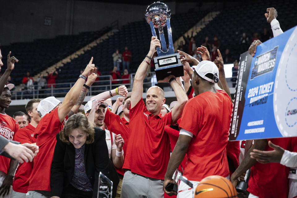 The Hilltoppers celebrate winning 78-71 over the UTEP Miners in an NCAA college basketball game to become the Conference USA men's basketball champions for the first time since 2013 at VBC Propst Arena in Huntington, Ala., on Saturday, March 16, 2024. WKU advances the NCAA tournament. (Grace Ramey/Daily News via AP)