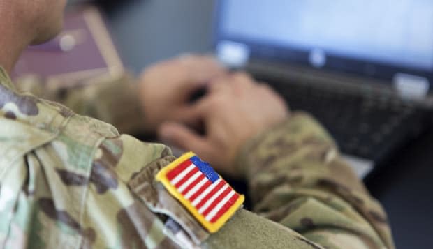 American soldier working on laptop