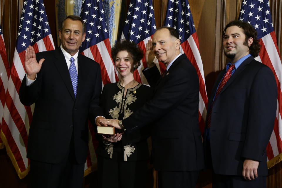 House Speaker John Boehner of Ohio performs a mock swearing in for Rep. William Enyart, D-Ill., Thursday, Jan. 3, 2013, on Capitol Hill in Washington, as the 113th Congress began. (AP Photo/Charles Dharapak) 