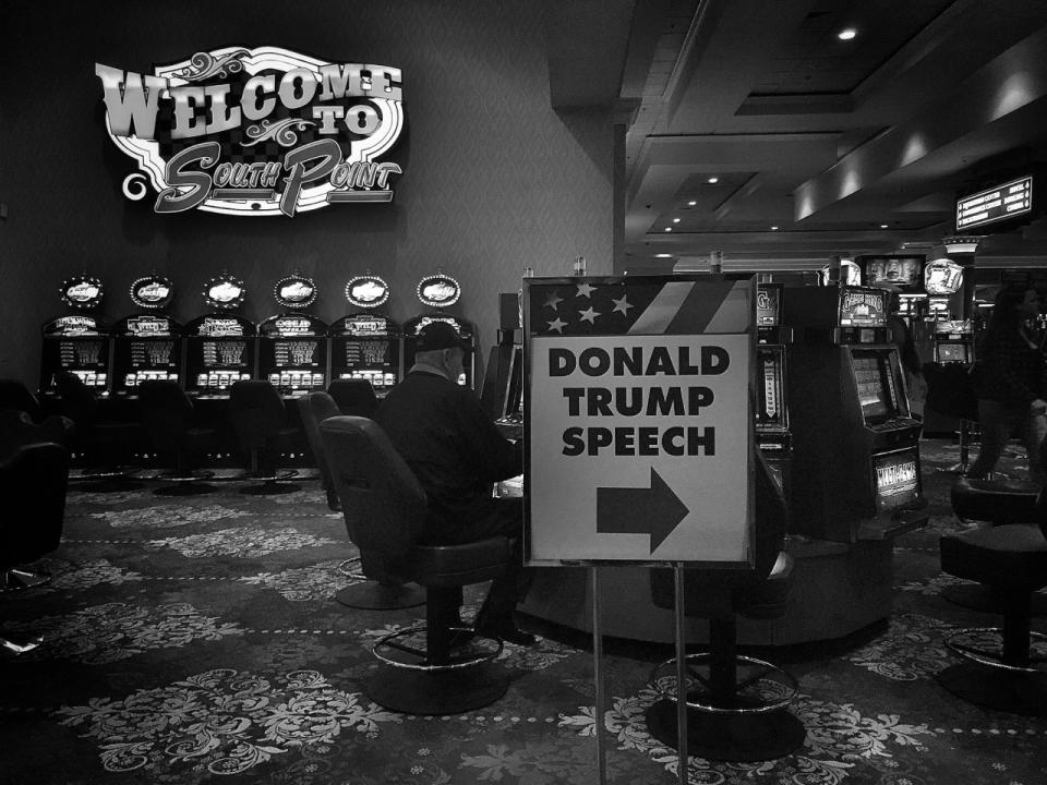 <p>A sign pointing to a Donald Trump rally is seen next to the slot machines inside the South Point Casino on Feb. 22 in Las Vegas. (Photo: Holly Bailey/Yahoo News) </p>