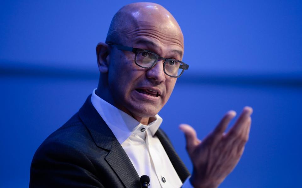 Satya Nadella, chief executive officer of Microsoft Corp., gestures as he speaks during a panel session on day two of the World Economic Forum - Jason Alden / Bloomberg