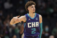 Charlotte Hornets guard LaMelo Ball (2) reacts after making a three-point basket against the Boston Celtics during the first half of an NBA basketball game in Charlotte, N.C., Monday, Oct. 25, 2021. (AP Photo/Jacob Kupferman)
