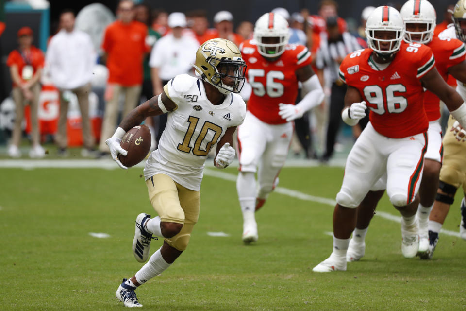 FILE - In this Saturday, Oct. 19, 2019, file photo, Georgia Tech wide receiver Ahmarean Brown runs for yardage during the first half of an NCAA college football game against Miami, in Miami Gardens, Fla. The Yellow Jackets will need big years from their receivers if they are to improve upon last season's unit, which finished 124th in scoring and fourth-worst among FBS schools in total offense.(AP Photo/Wilfredo Lee, File)