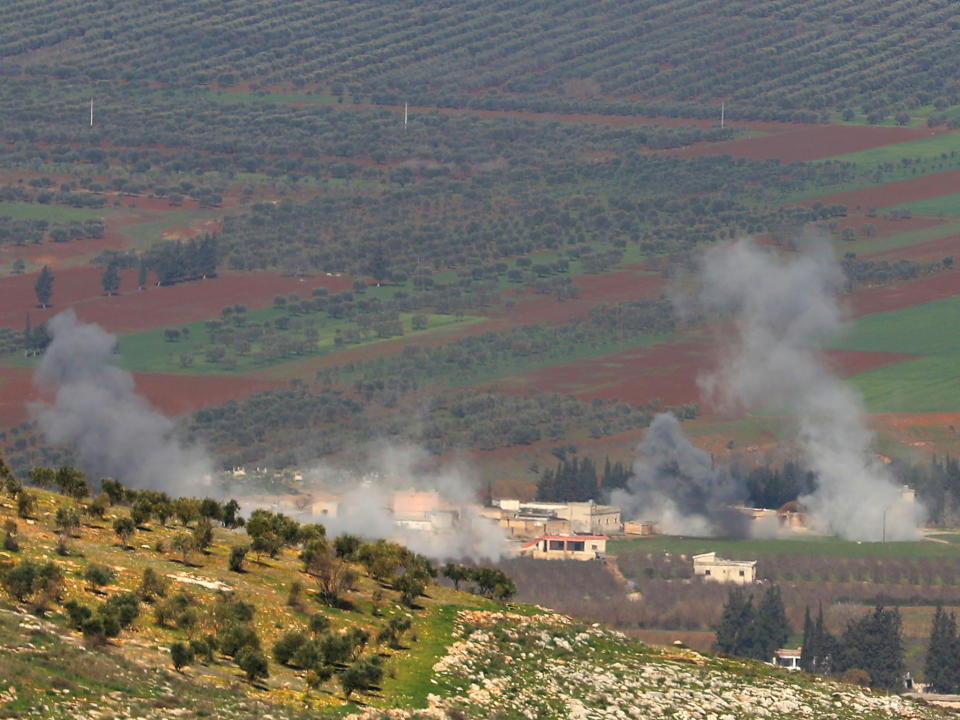 Turkish-backed Syrian rebel fighters fire from the town of Salwah, less than 10 kilometres from the Syria-Turkey border, towards Kurdish forces from the People's Protection Units (YPG) in the Afrin region: AFP/Getty