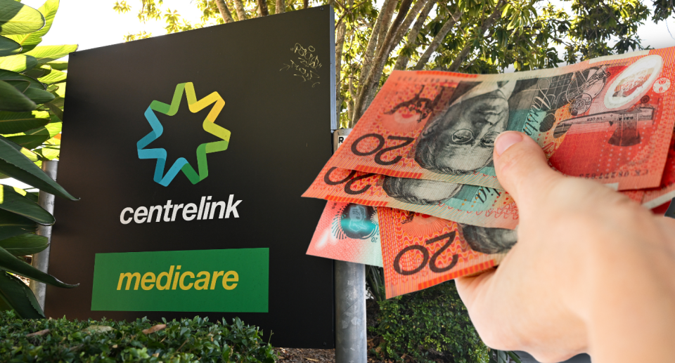 Centrelink sign next to person holding wad of $20 notes