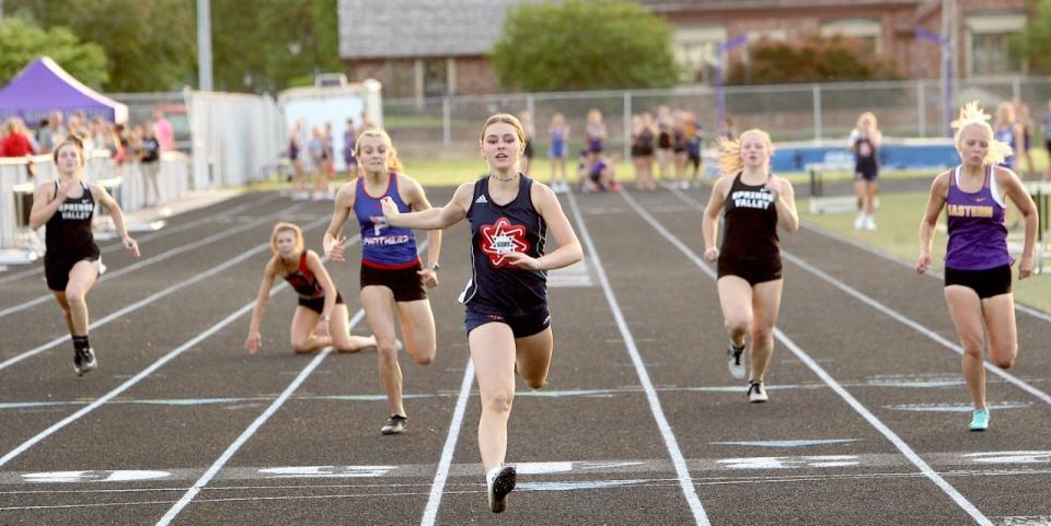 BNL senior Lindley Steele blows the field away in the 200-meter dash at the Seymour Sectional Tuesday night while setting a new school record of 26.34.