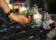 <p>People place flowers in honor for the victims of the Santa Fe High School shooting during a vigil at Texas First Bank Friday, May 18, 2018, in Santa Fe, Texas. (Photo: Godofredo A. Vasquez/Houston Chronicle via AP) </p>