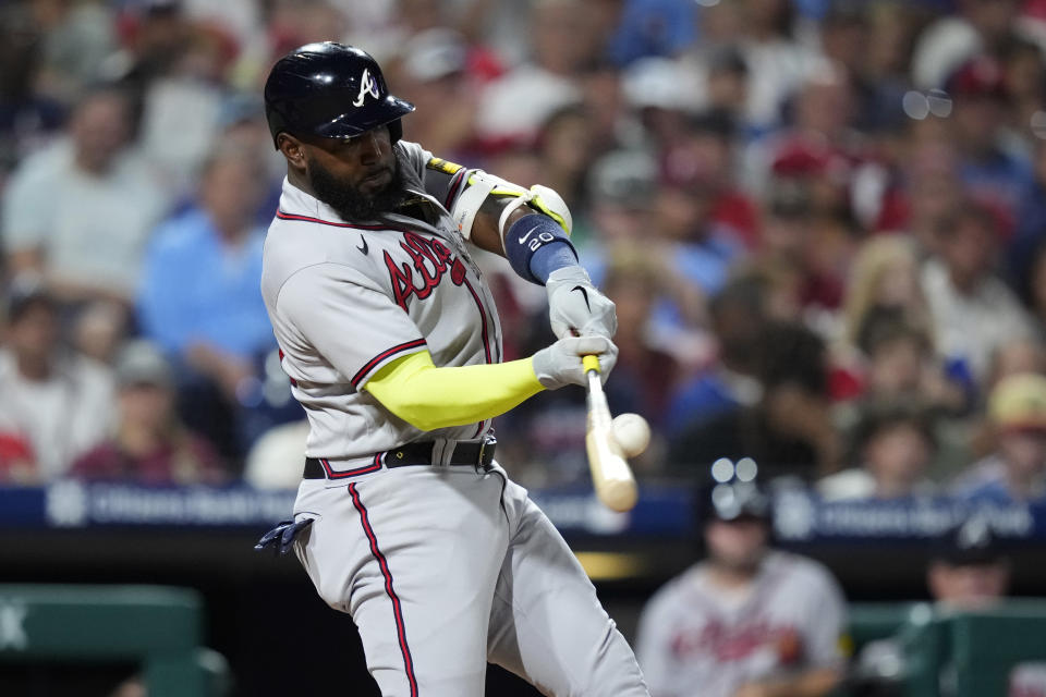 Atlanta Braves' Marcell Ozuna hits a three-run home run against Philadelphia Phillies pitcher Zack Wheeler during the fifth inning of a baseball game, Tuesday, Sept. 12, 2023, in Philadelphia. (AP Photo/Matt Slocum)