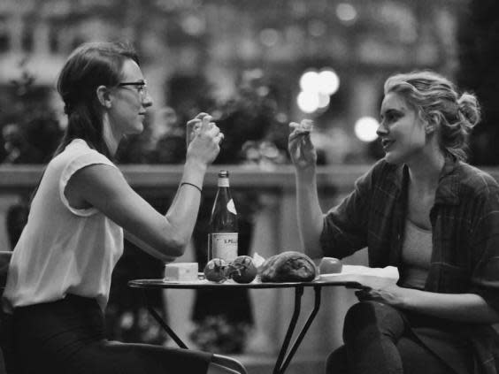 Sophie (Mickey Sumner) and Frances (Greta Gerwig) eat dinner together after work in Frances Ha. (IFC Films)