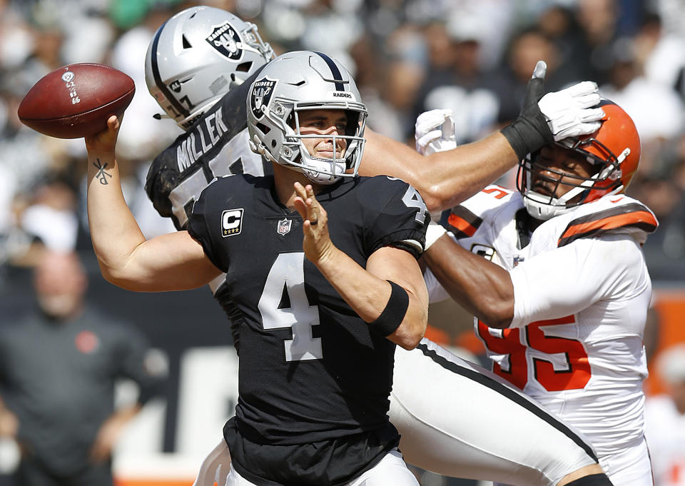 Raiders quarterback Derek Carr chucked it 58 times in a victory against the Browns. (AP)