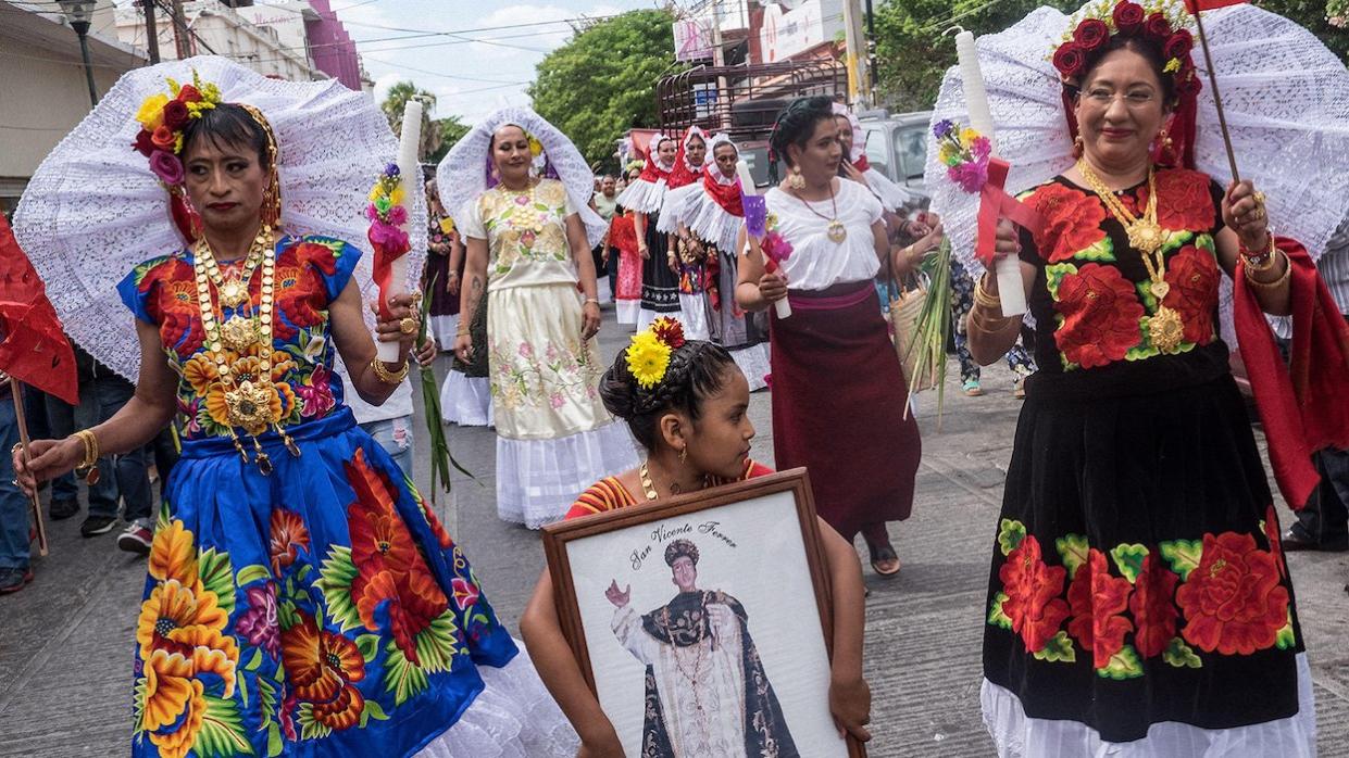 Dressed in traditional Zapotec attire, muxes in Juchitán, Mexico, partake in a parade for the annual 