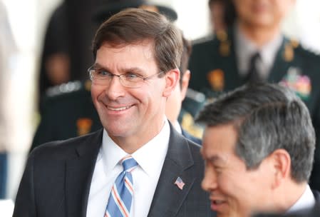 U.S. Secretary of Defense Mark Esper talks to South Korean Defence Minister Jeong Kyeong-doo as his arrives at the Defense Ministry in Seoul