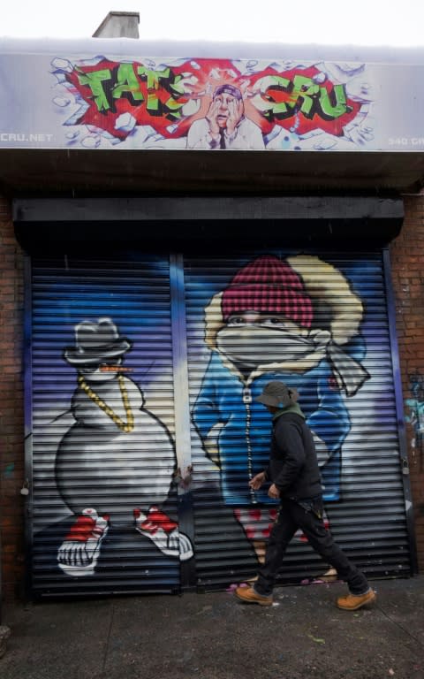 A worker with TATS CRU closes a storage locker at The Point in the Bronx borough of New York