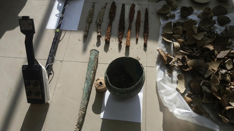 In this undated photo provided by the Albanian Police on Sunday, Feb. 12, 2017, Archaeological artifacts from ancient Apollonia on display, in Radostine, Albania. Albanian police say they have prevented the smuggling of 230 archaeological artifacts from ancient Apollonia and have arrested two people adding that the artifacts were found at the arrested men's houses in Radostine, a village 120 kilometers (75 miles) south of the capital, Tirana. (Albania Police via AP)