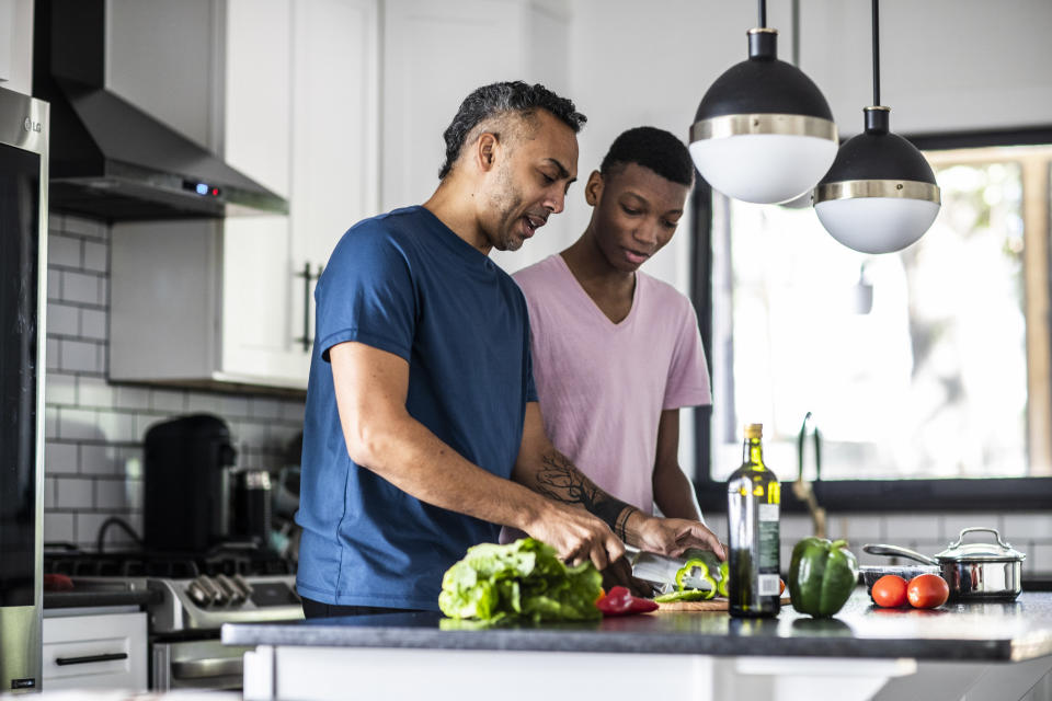 A father and son cooking together