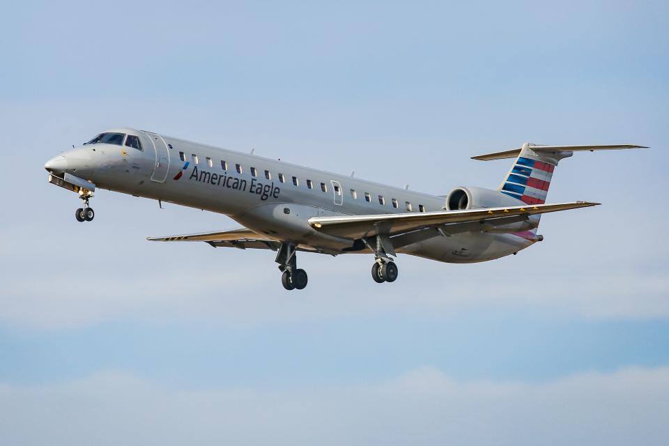 American Airlines Embraer ERJ-145 regional jet aircraft in the sky.