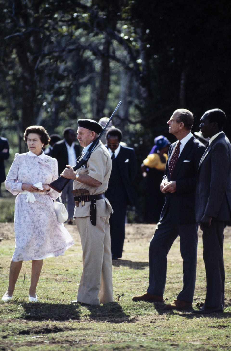 NAIROBI - NOVEMBER 13: Queen Elizabeth II and Prince Philip are shown around the 'Treetops' hotel by Richard Prickett on November 13, 1983 near Sagana in Kenya. It was thirty two years beforehand that the Queen had been staying at 'Treetops' when she learnt of her father's death and that she had become monarch. This return was a part of a 'Royal Tour' of Kenya. (Photo by David Levenson/Getty Images)