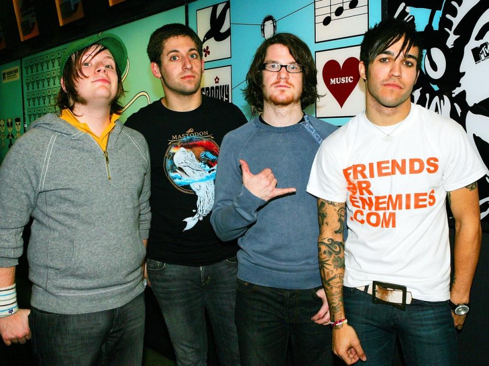 From left: Patrick Stump, Joe Trohman, Andrew Hurley and Pete Wentz backstage during MTV's Total Request Live in 2005 (Getty)