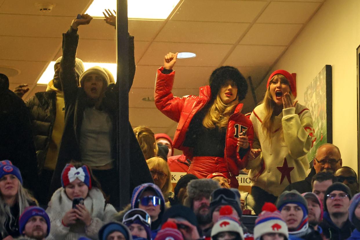 Taylor Swift, far right, and Brittany Mahomes react to Travis Kelce's touchdown reception from Patrick Mahomes in the Chiefs' divisional playoff win in Buffalo.