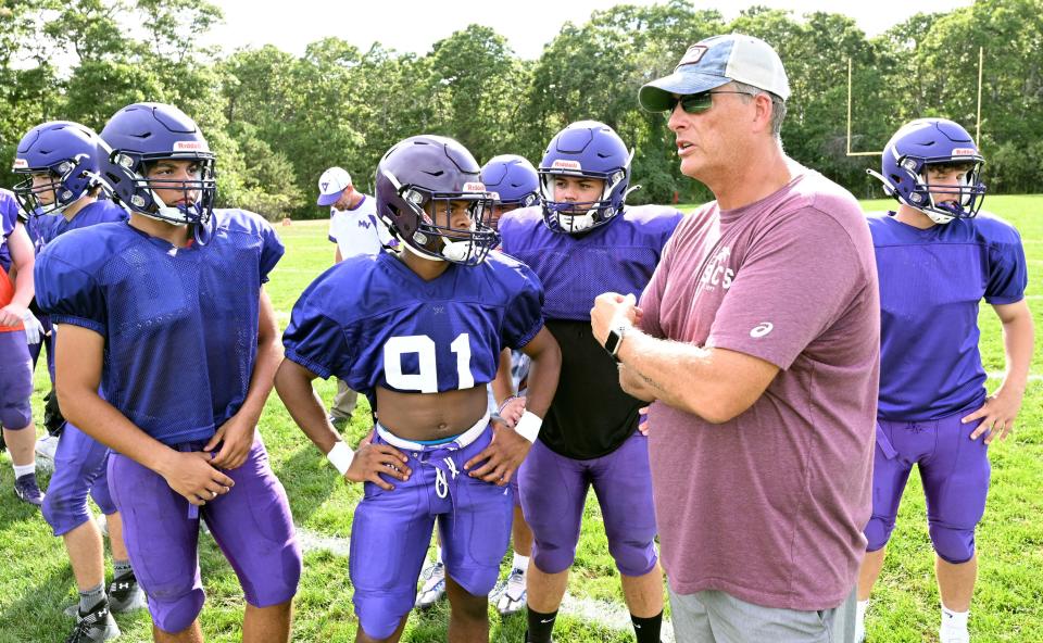 Martha's Vineyard head coach Tony Mottola guides his offense during scrimmage Tuesday against Upper Cape Tech in Mashpee.