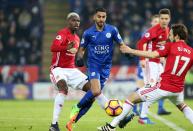 <p>Riyad Mahrez of Leicester City in action with Paul Pogba and Daly Blind of Manchester United during the Premier League match between Leicester City and Manchester United at King Power Stadium on February 05 , 2017 in Leicester, United Kingdom. </p>