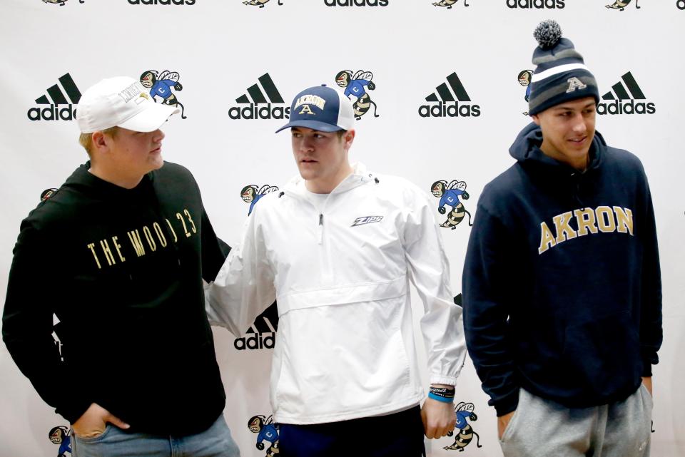 Gabe Gaines (Lindenwood), Jax Smith (Akron) and Steele Wasel (Akron) react after signing their letters on intent during a signing ceremony at Choctaw High School in Choctaw, Okla., Wednesday, Dec.14, 2022.