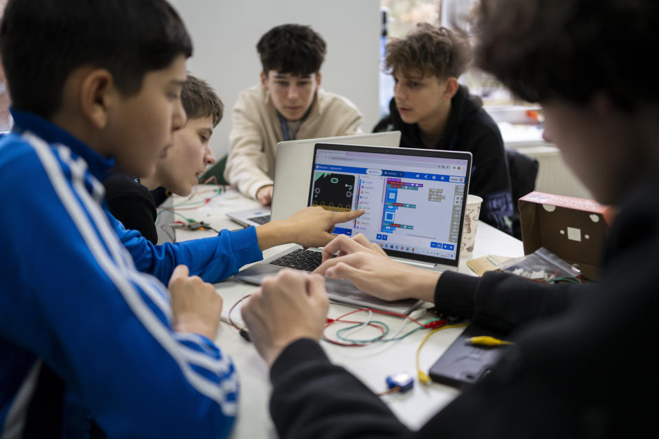 Young members of Ukraine's ethnic Hungarian minority attend a computer class at a weekend education program in Berehevo, Saturday, Jan. 27, 2024. Ukraine amended its laws to comply with EU membership requirements, and restored many of the language rights for minorities demanded by Budapest but Hungary's government has indicated it is not fully satisfied — a potentially explosive sticking point as EU leaders meet Thursday, Feb. 1, 2024 to try and break Orban's veto of a major aid package earmarked for Kyiv. (AP Photo/Denes Erdos)