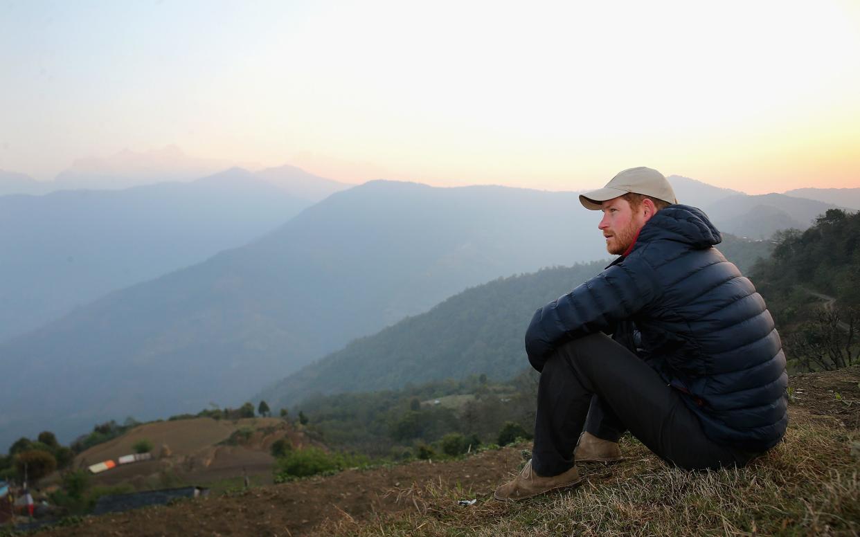 Prince Harry watches the sun rise after spending the night in the Himalayan hilltop village of Leorani on his visit to Nepal in March 2016  - 2016 Getty Images