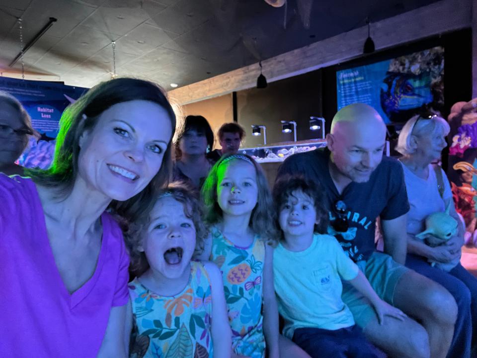 The Bailey family awaiting a mermaid performance at Mertailors Mermaid Aquarium.