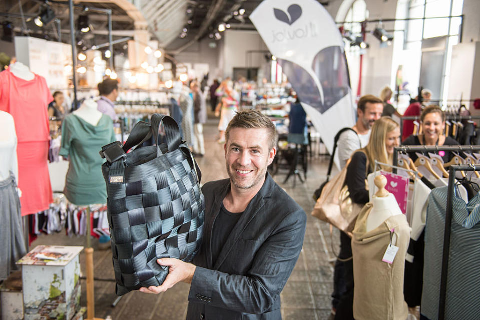 BERLIN, GERMANY - JULY 08:  Christian Adelsberger of 'Kastner + Oehler' presents a bag of the label '959' made of recycled seatbelts at the Ethical Fashion Show at Postbahnhof on July 8, 2015 in Berlin, Germany. Adelsberger emphasized the importance of innovative labels for retailer: 'Green fashion is an asset and a real add-on for the trade.' Bigger than ever: 160 international labels are presenting sustainably produced collections for summer 2016 at the Greenshowroom and Ethical Fashion Show Berlin.(Photo by Thomas Lohnes/Getty Images)