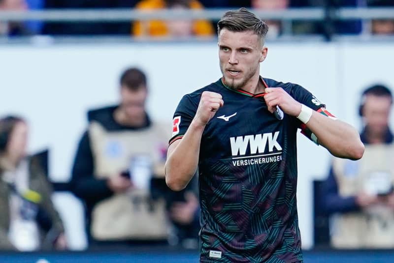 Augsburg's Ermedin Demirovic celebrates after socring their side's third goal during the German Bundesliga soccer match between SV Darmstadt 98 and FC Augsburg at Merck-Stadion am Boellenfalltor. Uwe Anspach/dpa