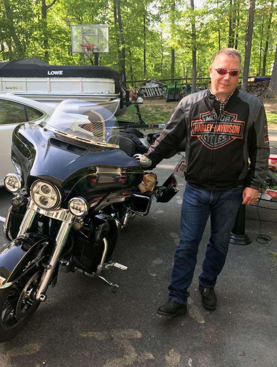 Keedysville resident Scott Spitnale at home with his Harley-Davidson motorcycle before a June 2021 crash left him with severe injuries.