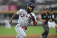 Cleveland Indians' Amed Rosario rounds third base before scoring on a Franmil Reyes double during the sixth inning of the team's baseball game against the Chicago White Sox on Saturday, July 31, 2021, in Chicago. (AP Photo/Paul Beaty)