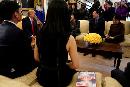 U.S. President Donald Trump meets with North Korean defectors in the Oval Office of the White House in Washington, U.S., February 2, 2018. REUTERS/Yuri Gripas