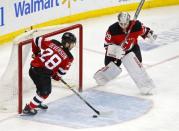 Mar 19, 2019; Newark, NJ, USA; New Jersey Devils defenseman Damon Severson (28) makes a save in front of Devils goaltender Mackenzie Blackwood (29) against the Washington Capitals during the third period at Prudential Center. Mandatory Credit: Noah K. Murray-USA TODAY Sports