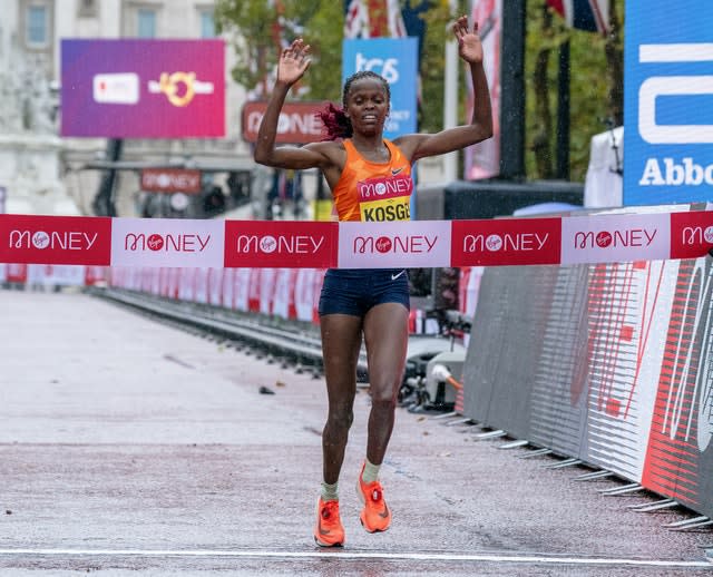 Brigid Kosgei celebrates as she crosses the line 