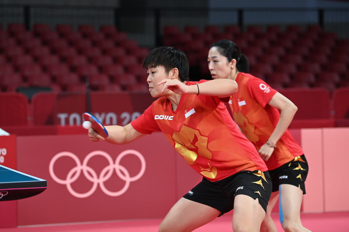 Singapore paddlers Lin Ye (front) and Yu Mengyu during the women's team round-of-16 tie against France at the 2020 Tokyo Olympics. (PHOTO: Jung Yeon-je/AFP)