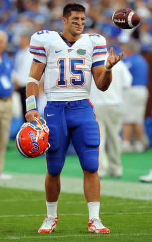 <p>Jim Rinaldi/Icon SMI/Corbis/Icon Sportswire via Getty</p> Tim Tebow plays with the Florida Gators in 2009.