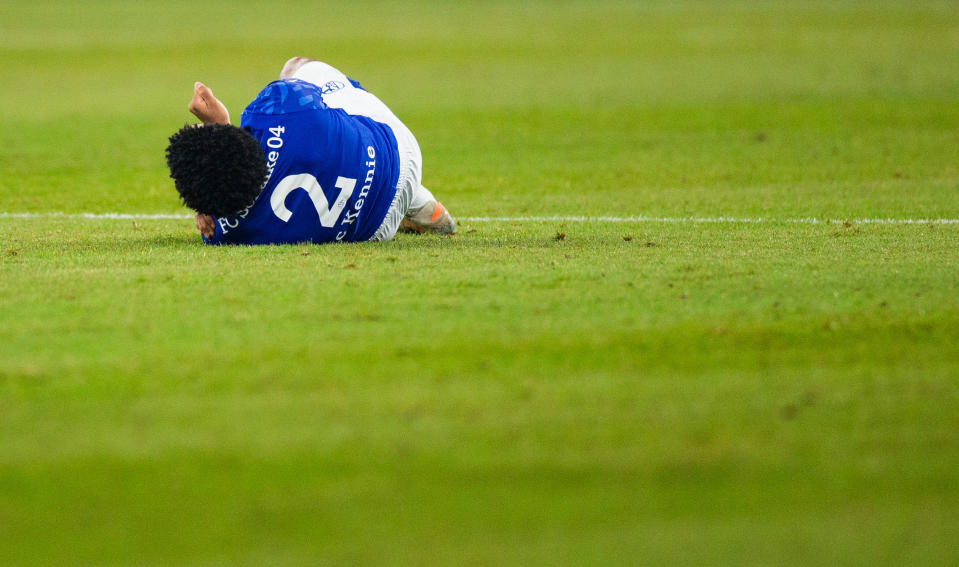 15 December 2019, North Rhine-Westphalia, Gelsenkirchen: Soccer: Bundesliga, FC Schalke 04 - Eintracht Frankfurt, 15th matchday in the Veltins Arena. Schalkes Weston McKennie lies on the grass after a duel with Frankfurt's Dost. Photo: Rolf Vennenbernd/dpa - IMPORTANT NOTE: In accordance with the requirements of the DFL Deutsche Fußball Liga or the DFB Deutscher Fußball-Bund, it is prohibited to use or have used photographs taken in the stadium and/or the match in the form of sequence images and/or video-like photo sequences. (Photo by Rolf Vennenbernd/picture alliance via Getty Images)