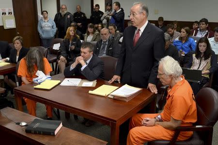 Deborah Leonard (L) and Bruce Leonard (R) sit next to their attorneys Devin Garramone (2nd L) and Don Gerace (2nd R) in court for a manslaughter charge against them in the death of their 19-year-old son Lucas Leonard, in New Hartford, New York October 16, 2015. REUTERS/Tina Russell/Observer-Dispatch/Pool