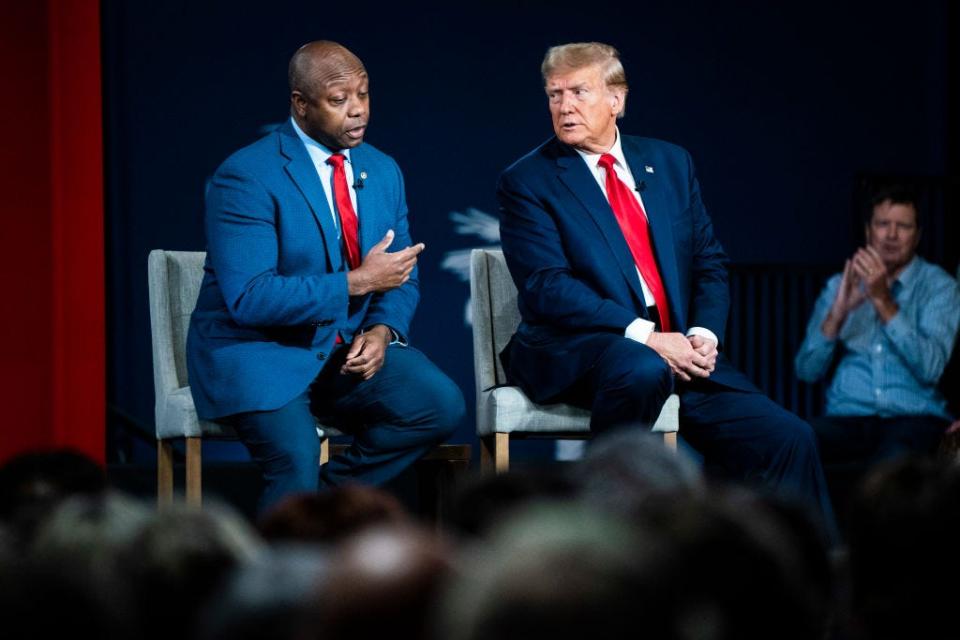 Tim Scott and Donald Trump at a campaign event in New Hampshire in January 2024