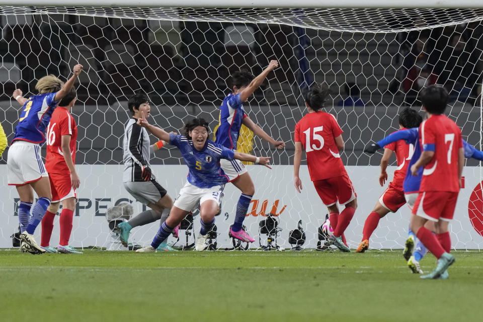 Japan's Hana Takahashi, centre, celebrates after scoring the first goal for her side during the final qualifier for the Paris Olympic women's football tournament between Japan and North Korea at the National Stadium Wednesday, Feb. 28, 2024, in Tokyo. (AP Photo/Eugene Hoshiko)