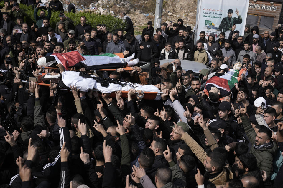 Palestinian mourners carry Mohammed Daraghmeh, 26, foreground, and Muhammad Bayadsa 32, and Osama Zalat 31, during their funeral in the West Bank town of Tubas, Tuesday, Feb. 27, 2024. Israeli troops shot and killed three Palestinian men including Daraghmeh, a co-founder of the local branch of Islamic Jihad in the northern town of Tubas, early Tuesday, Palestinian health authorities said. Thee was no immediate comment from the Israeli military. (AP Photo/Majdi Mohammed)