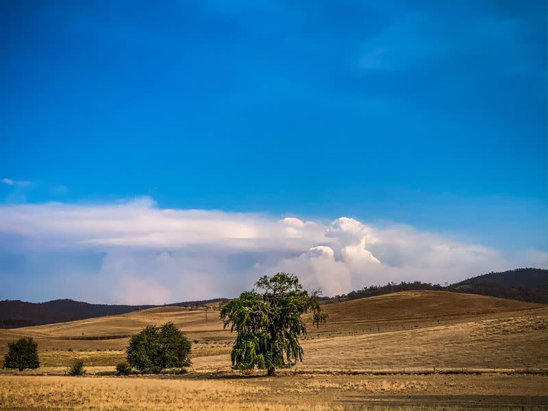 Fire clouds are formed over the mountains' range near Bredbo