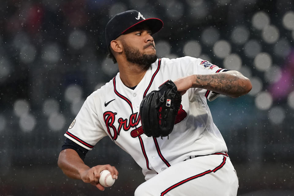 Atlanta Braves starting pitcher Huascar Ynoa winds up during the first inning of the team's baseball game against the Colorado Rockies on Wednesday, Sept. 15, 2021, in Atlanta. (AP Photo/John Bazemore)