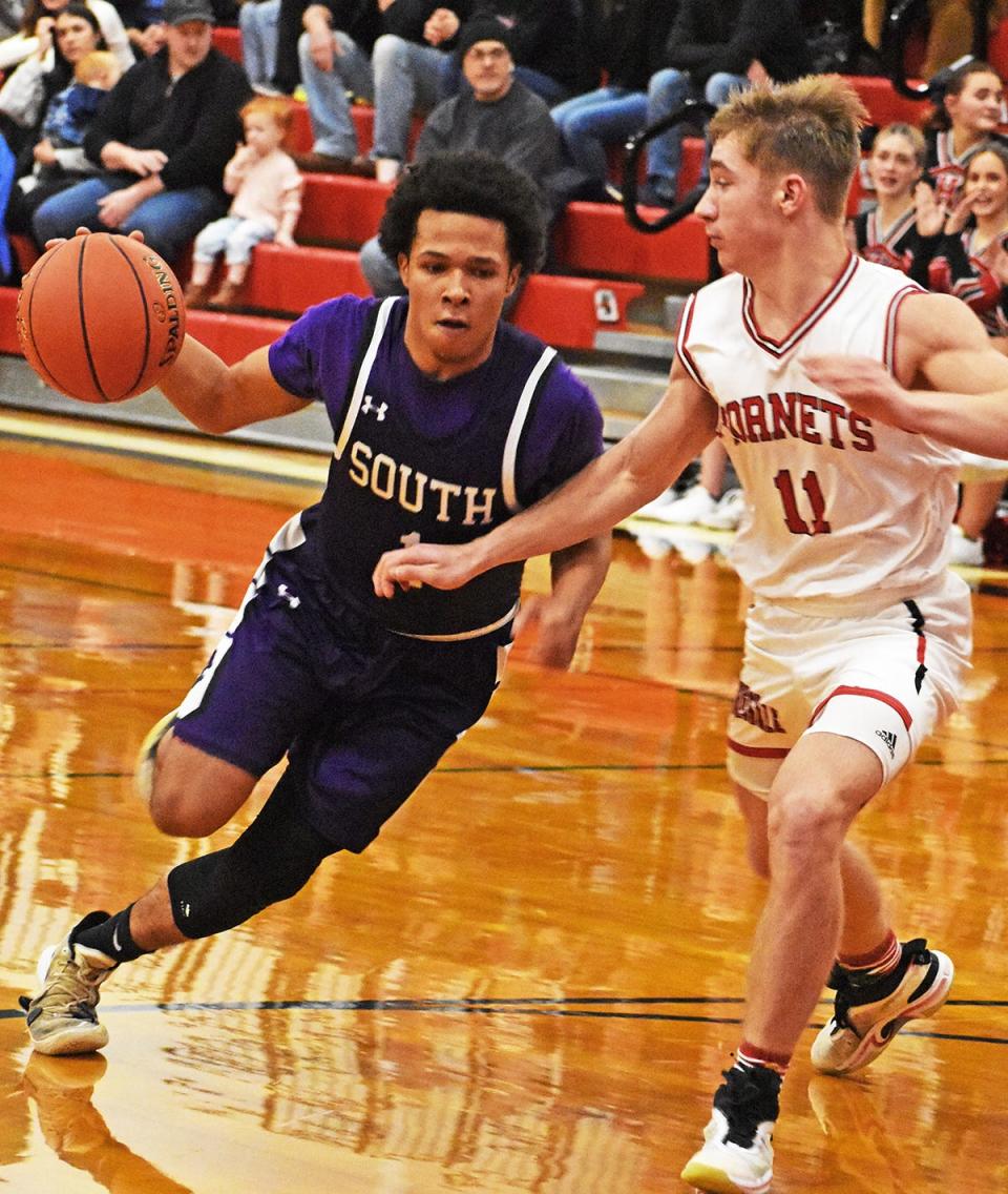 East Stroudsburg South point guard Michael Patterson (1) looks to drive against Honesdale during Wednesday night's championship game of the 62nd Annual Jaycees Holiday Tournament.