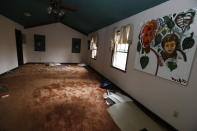 A muddy soaked rug is evidence of the Pearl River flooding this Jackson, Miss., home, Wednesday, Feb. 19, 2020. Residents have started cleanup to lessen the danger of mold. (AP Photo/Rogelio V. Solis)